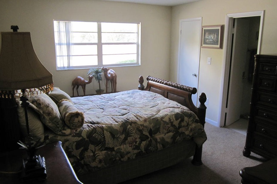 A large bed sits in the middle of one of the bedrooms in the two-bedroom rental. 