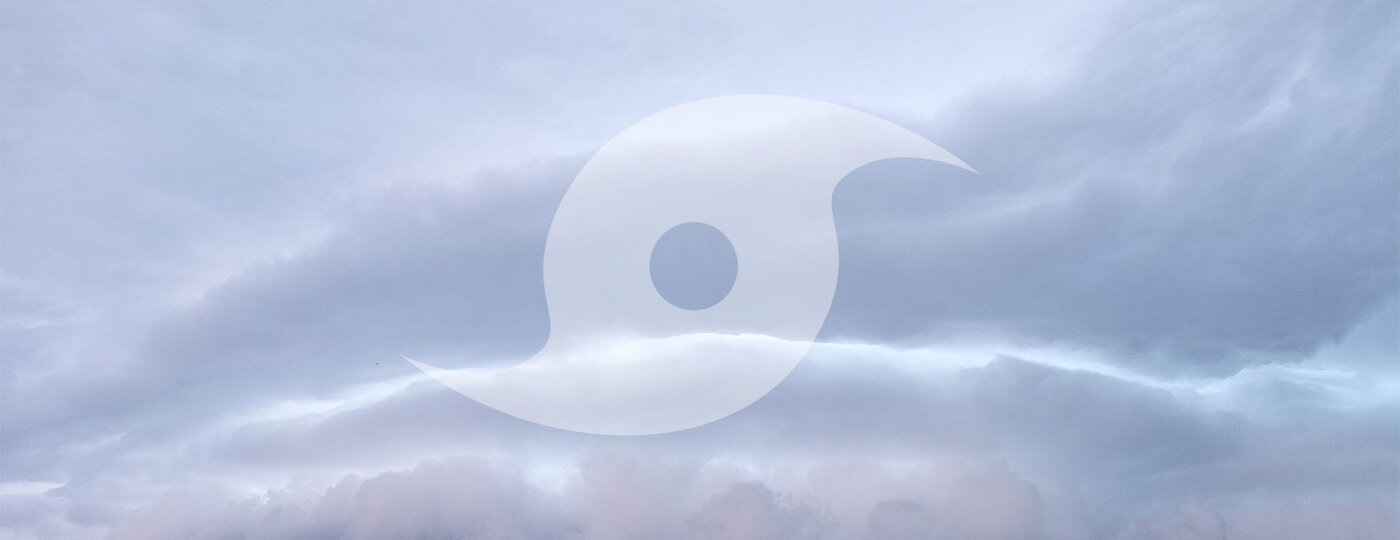 A hurricane symbol with a gloomy sky.