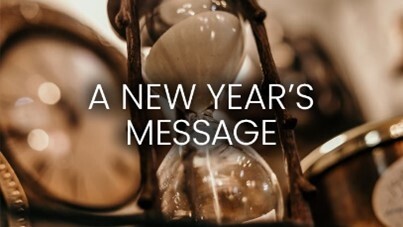 A New Year's Message text in front of an hourglass.