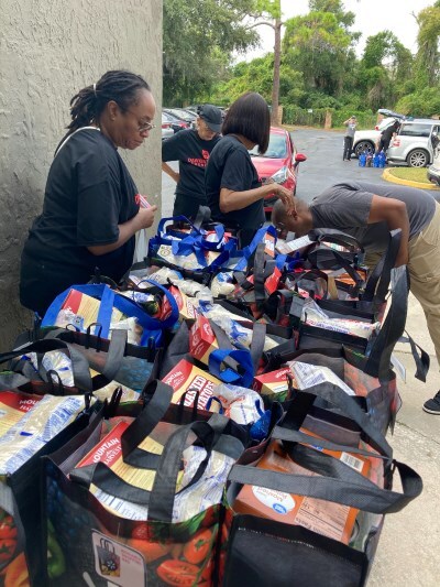 Volunteers handing out baskets.