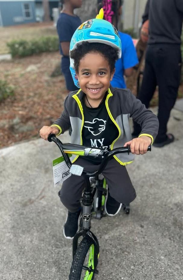 Little boy riding a bicycle.