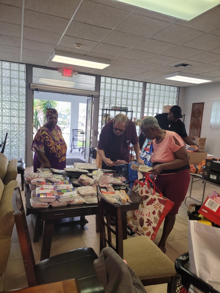 People getting items from the food pantry.