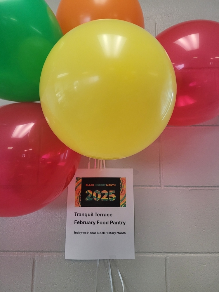 Black History Month 2025 flyer under a bunch of balloons.