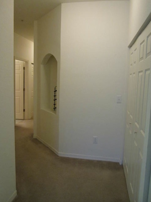 An interior wall and hallway of an apartment at Railroad Avenue.
